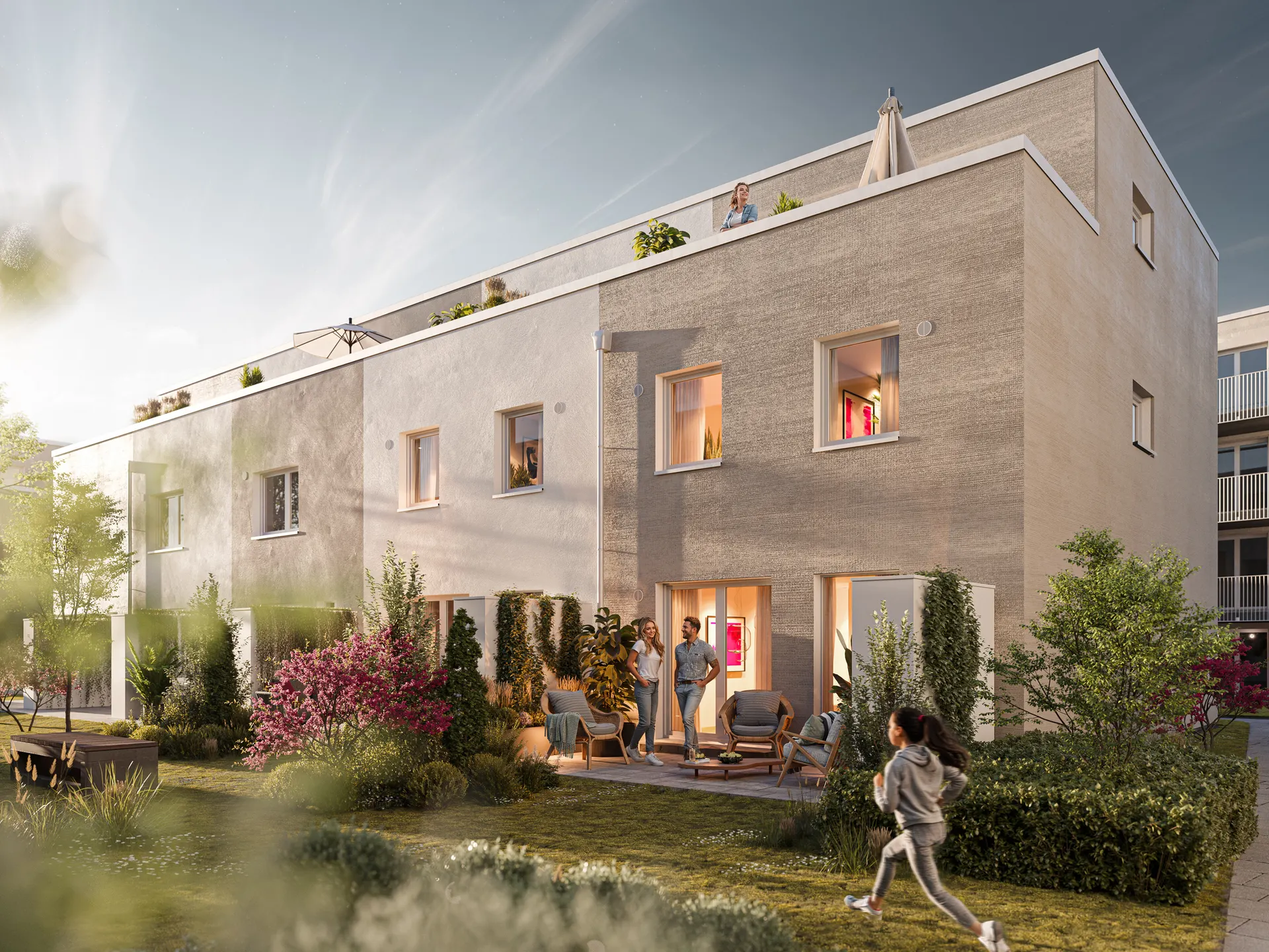 Reihenhäuser im Quartier Urban Alb am Abend, Gartenseite mit Terrassen und Dachterrassen